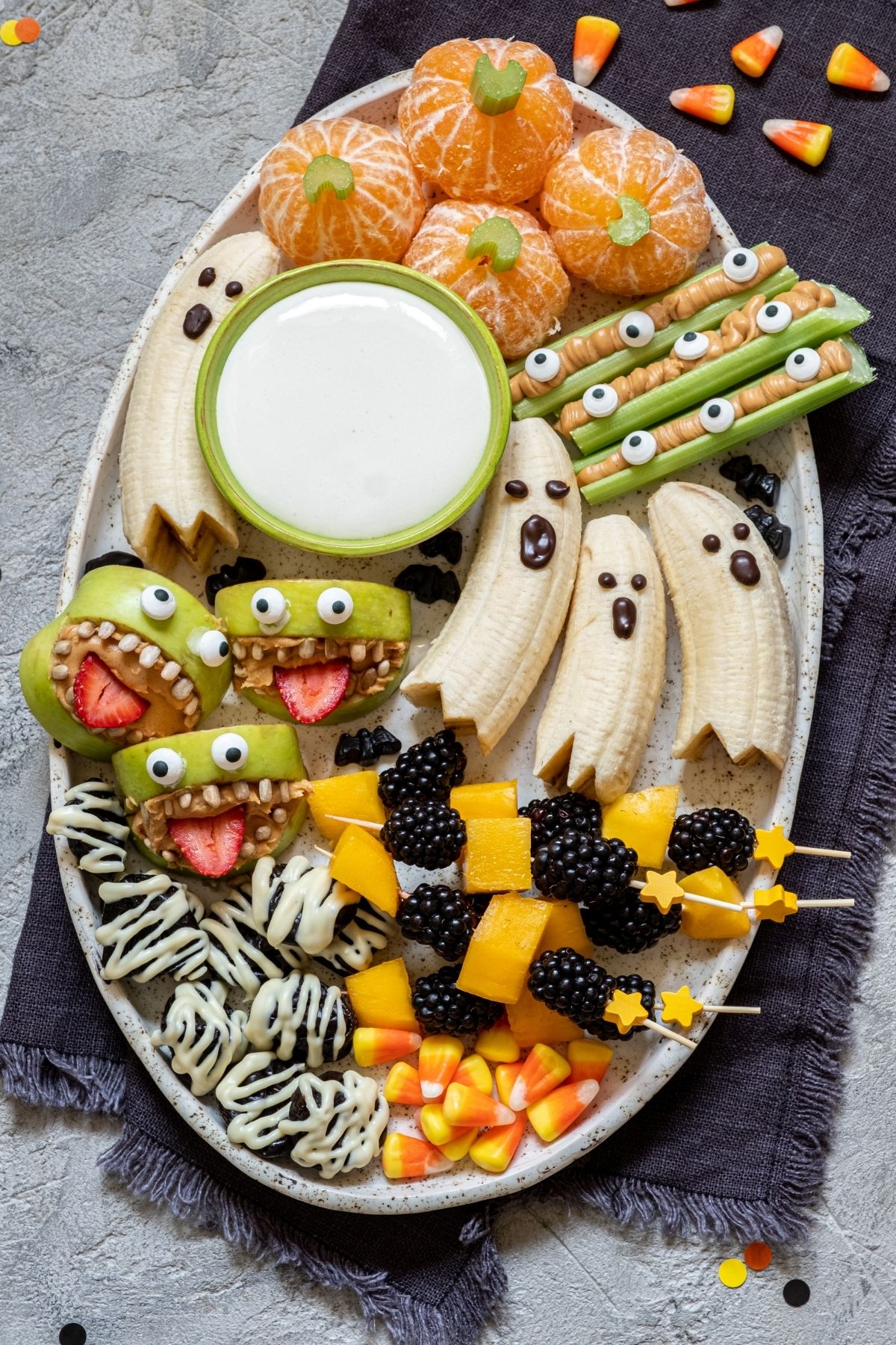 healthy halloween snack tray with lots of spooky goodies.
