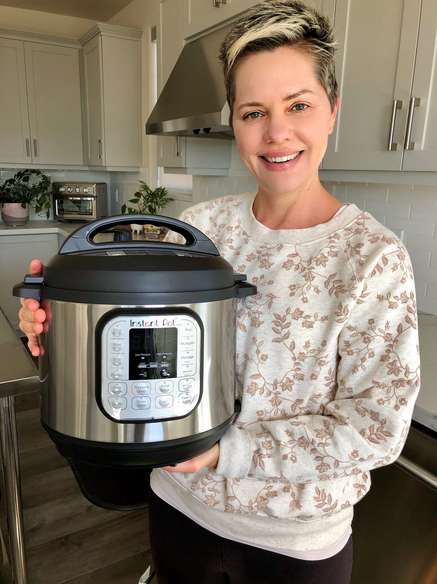 https://www.cleaneatingkitchen.com/wp-content/uploads/2021/02/carrie-holding-instant-pot-duo.jpeg