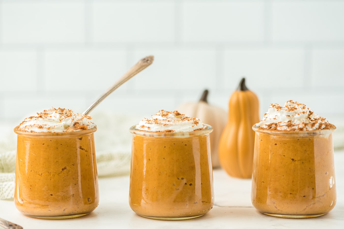 https://www.cleaneatingkitchen.com/wp-content/uploads/2021/10/instant-pot-pumpkin-pudding-in-three-jars.jpg