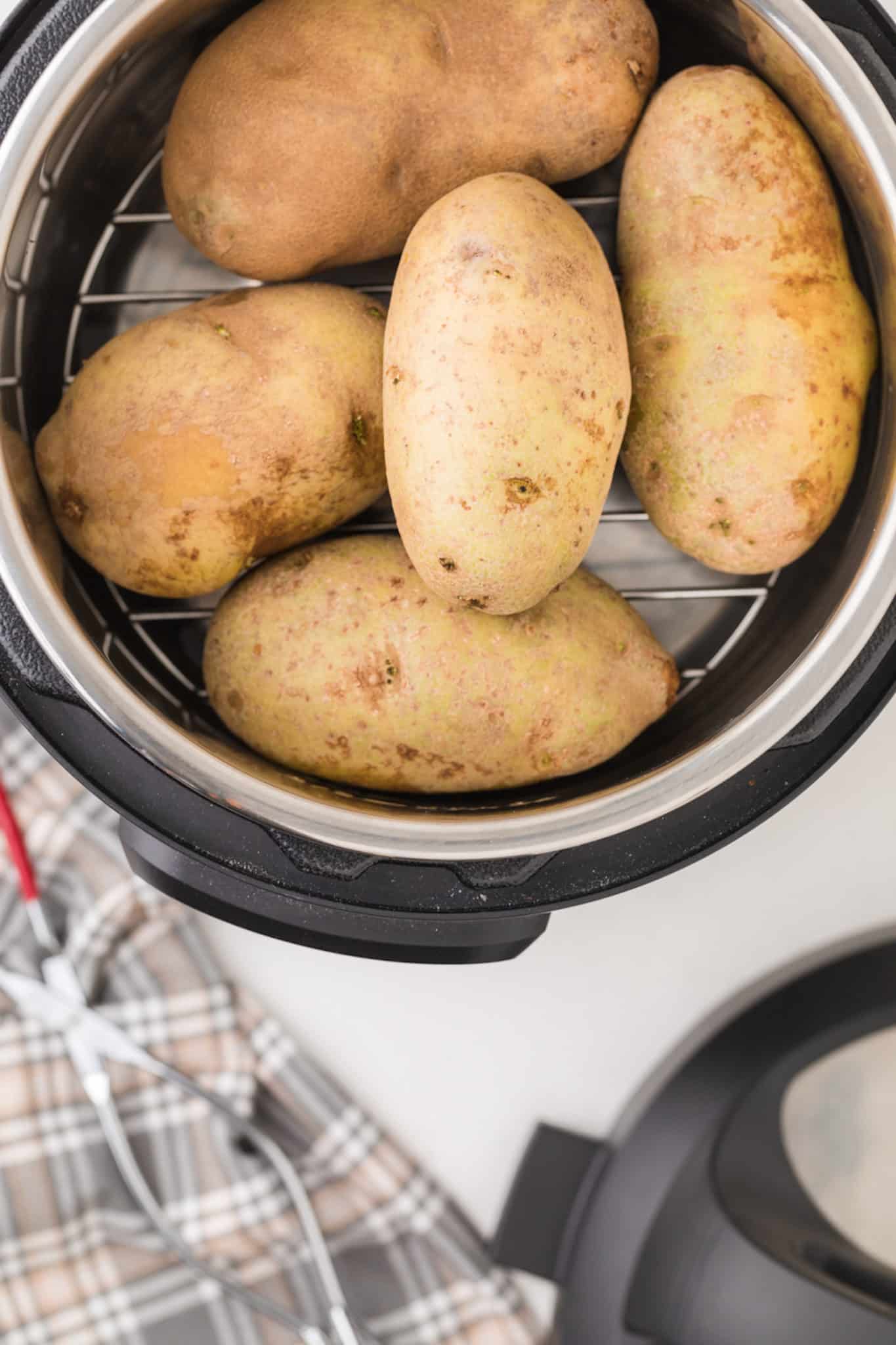 https://www.cleaneatingkitchen.com/wp-content/uploads/2021/11/baked-potatoes-in-instant-pot-scaled.jpg