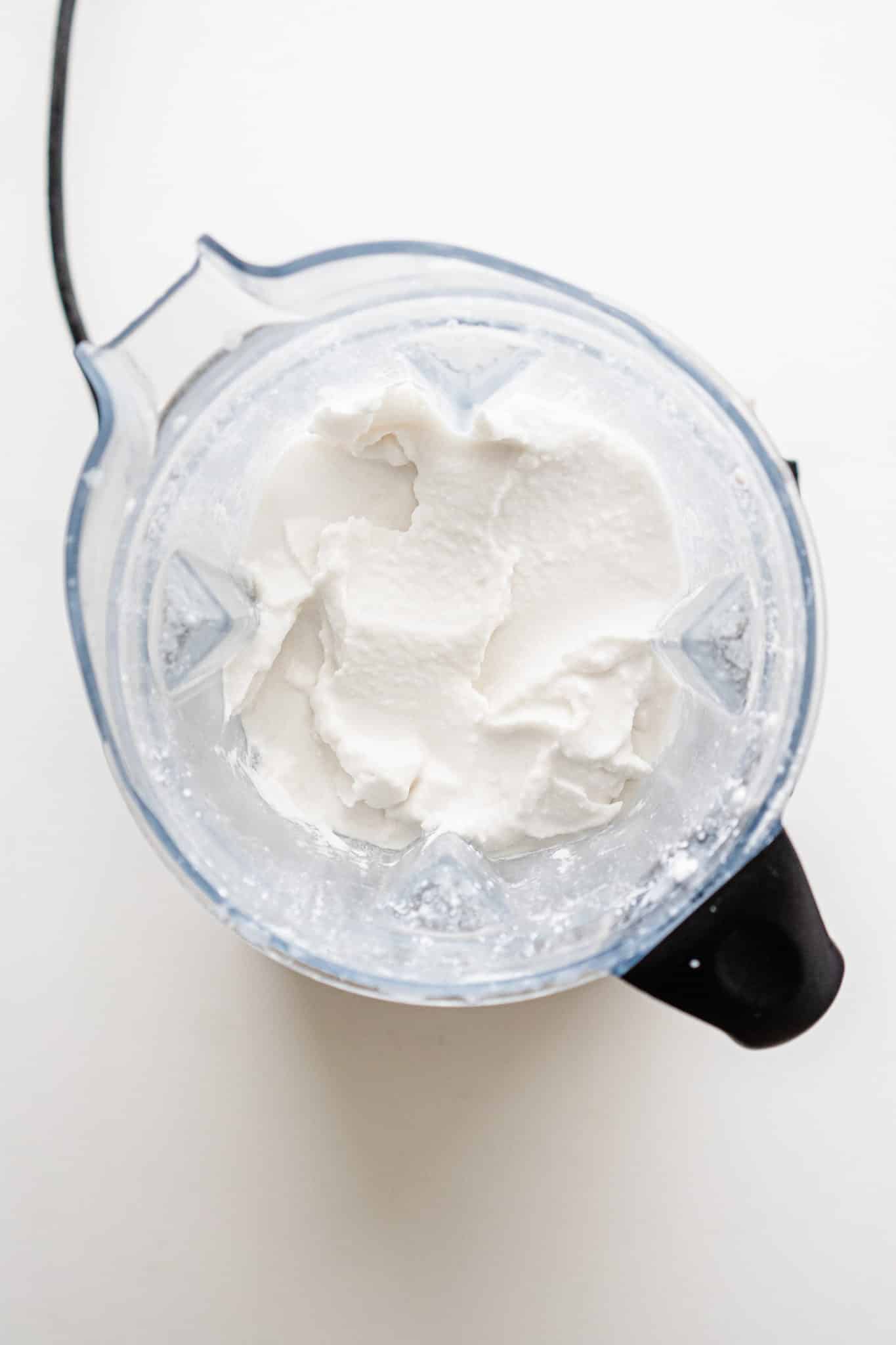 Blended vanilla ice cream in the jar of a Vitamix.