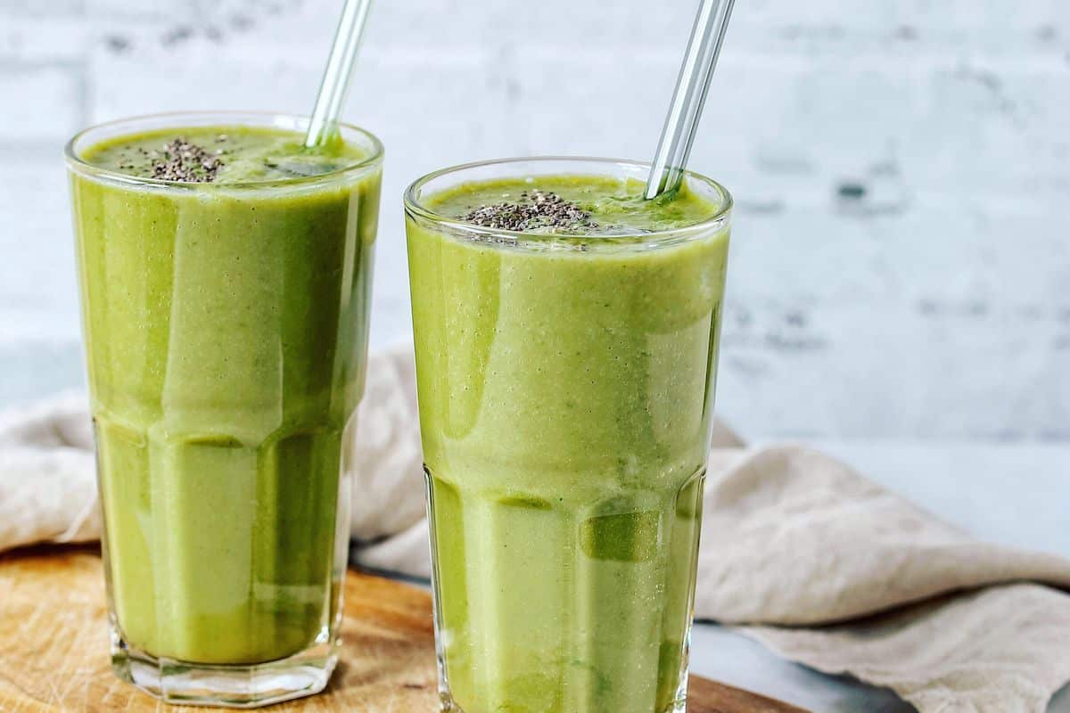 https://www.cleaneatingkitchen.com/wp-content/uploads/2022/06/green-smoothie-on-table-with-chia-seeds-and-glass-straw.jpg