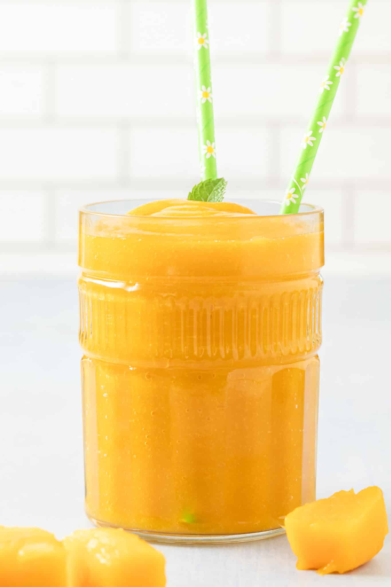 https://www.cleaneatingkitchen.com/wp-content/uploads/2022/08/mango-juice-glass-hero-scaled.jpg