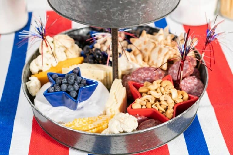 a 4th of July charcuterie board full of red, white and blue snacks.