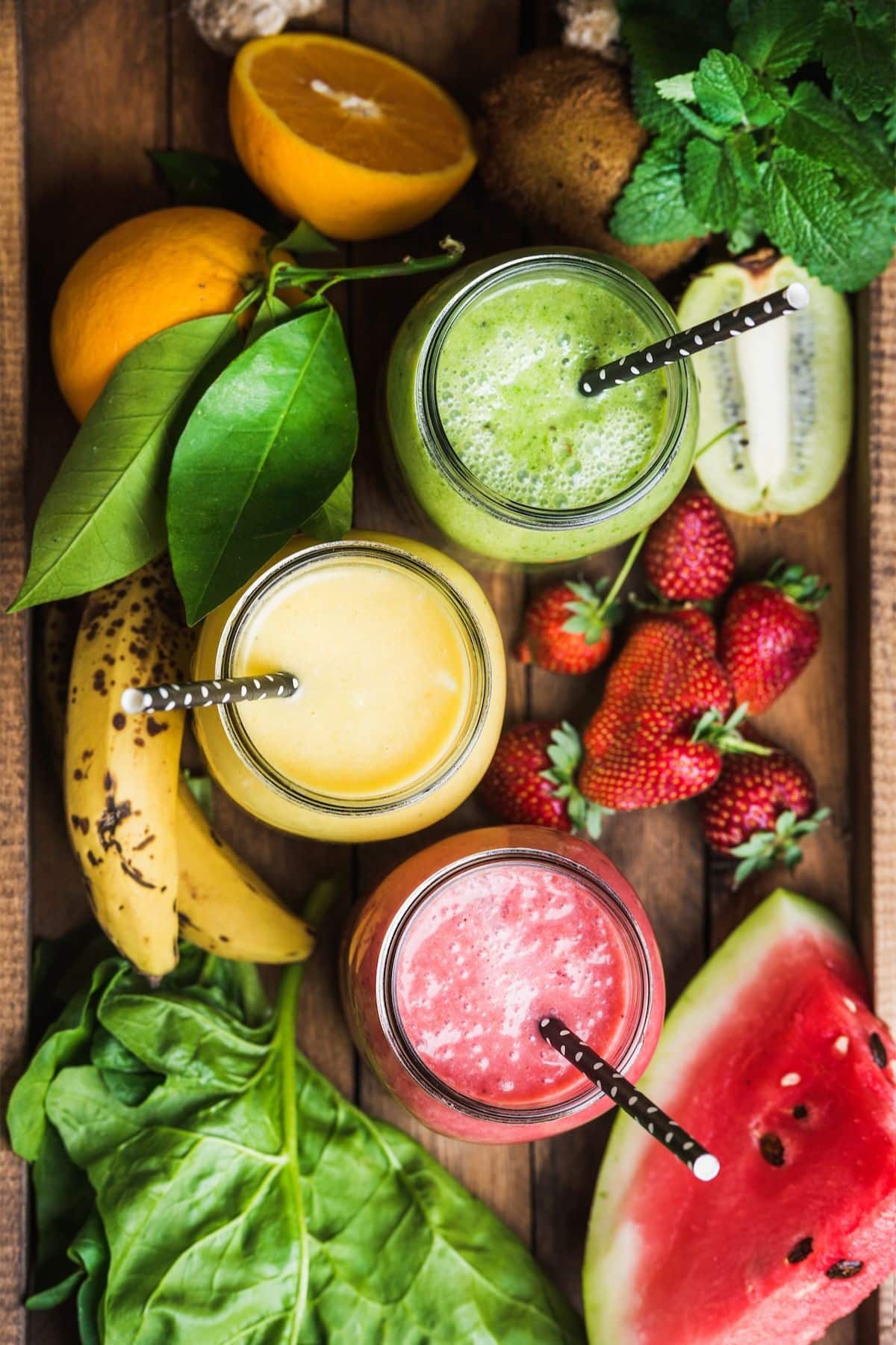 colorful summer smoothies on a tray.