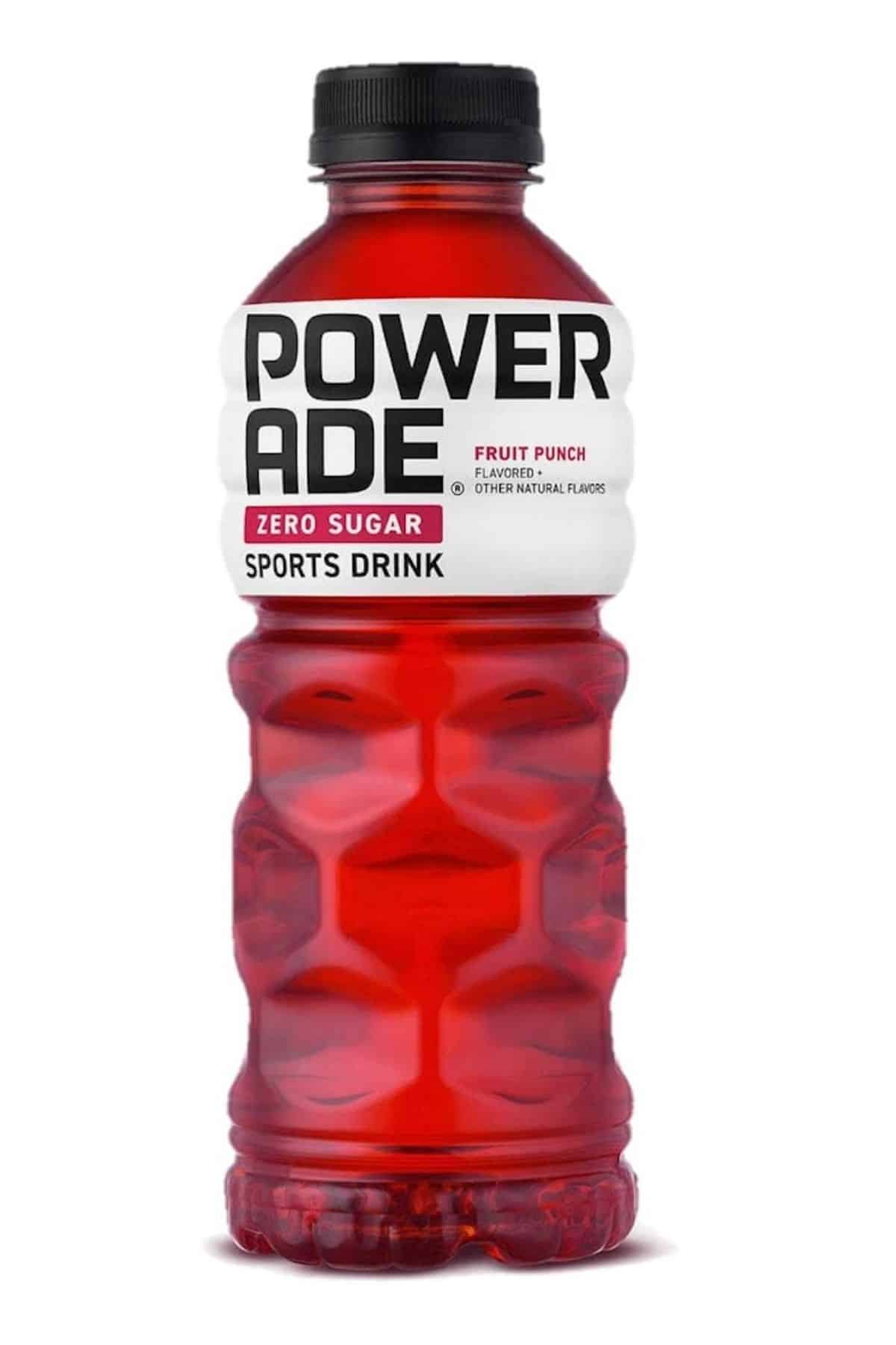 red powerade sports drink on table.