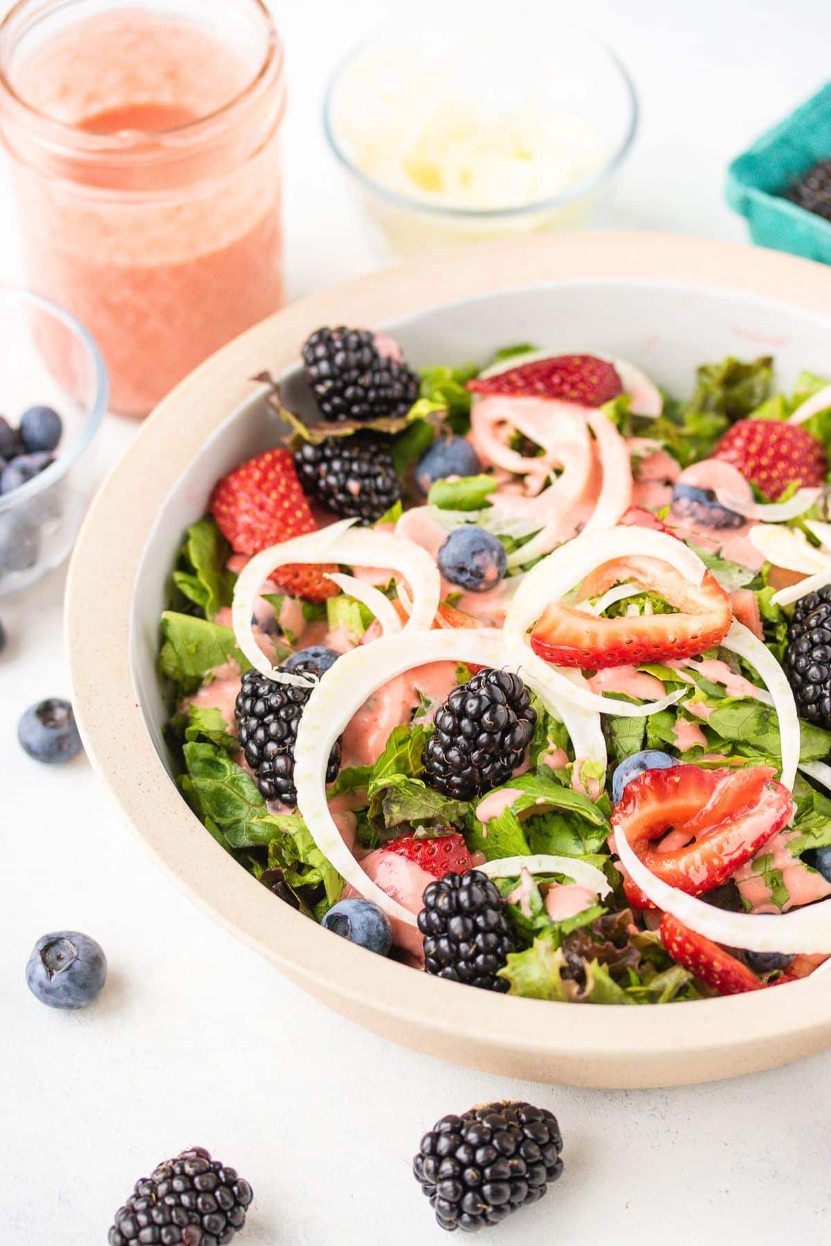 colorful summer salad with berries on table.